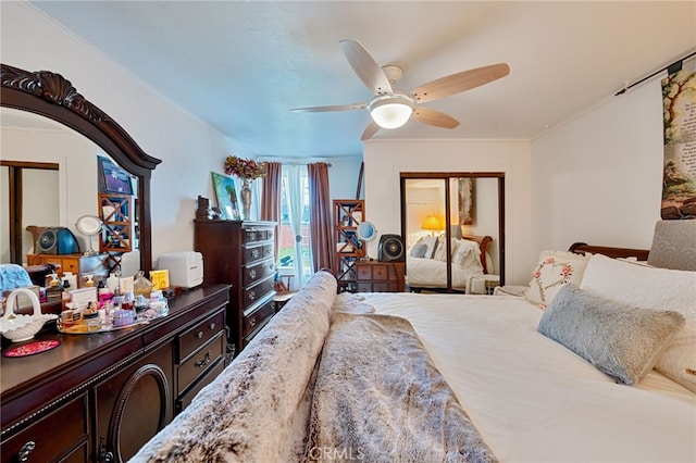 bedroom with a ceiling fan, a closet, and crown molding