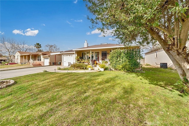 ranch-style home with a garage, a front yard, concrete driveway, and a chimney