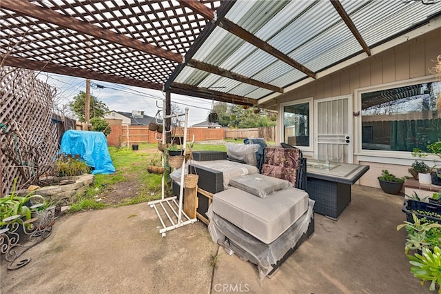 view of patio featuring a fenced backyard, an outdoor living space, and a pergola