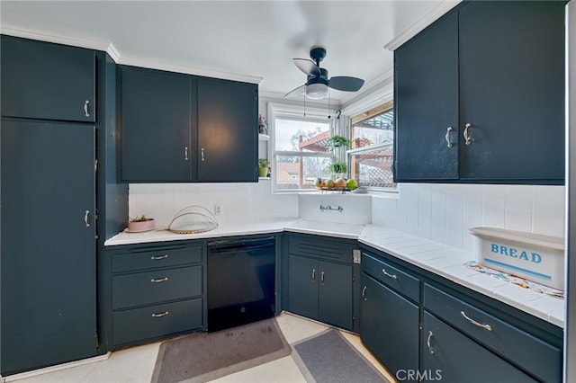 kitchen featuring black dishwasher, light countertops, decorative backsplash, ornamental molding, and a sink