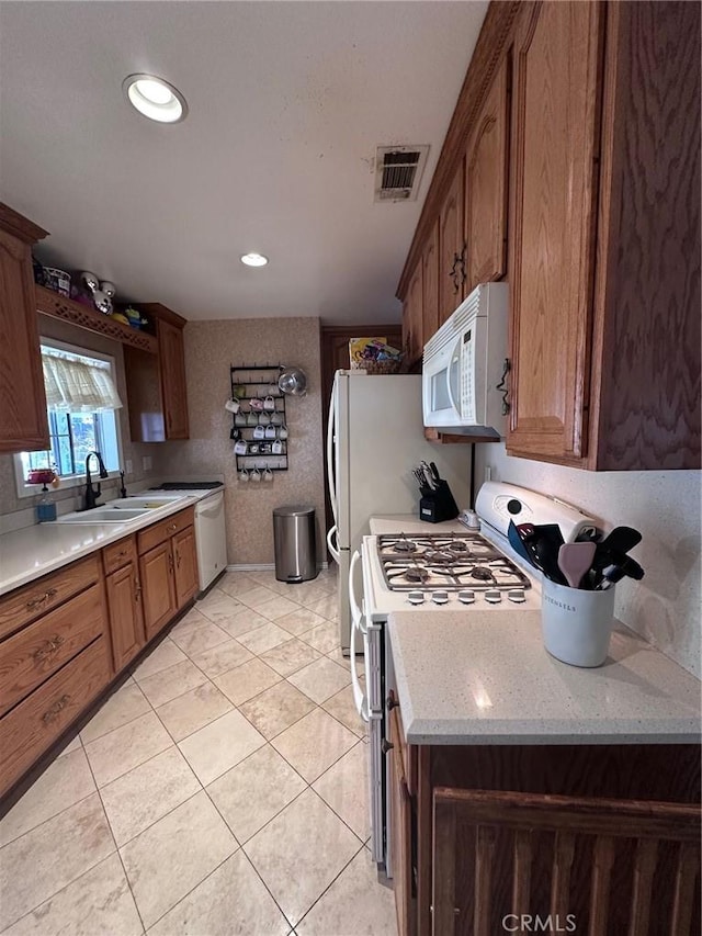 33518 Colorado St, Yucaipa, CA 92399 - kitchen with light tile patterned floors, visible vents, white appliances, and a sink
