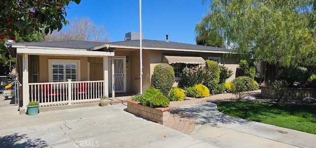 33518 Colorado St, Yucaipa, CA 92399 - ranch-style house featuring covered porch, stucco siding, and a chimney