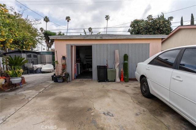 detached garage with a storage shed