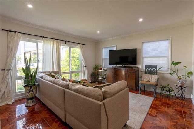 living room featuring crown molding, baseboards, and recessed lighting