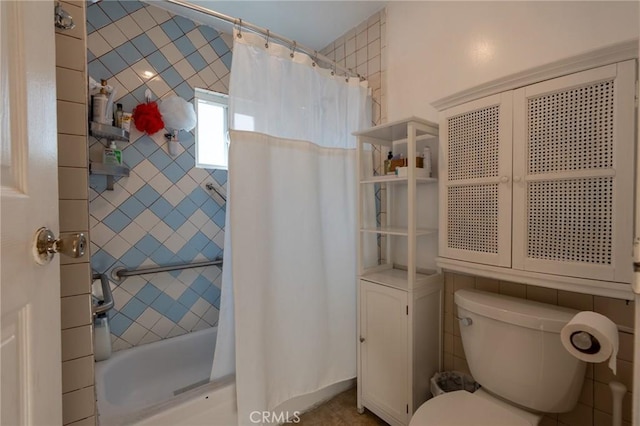 full bathroom with toilet and shower / bath combo with shower curtain