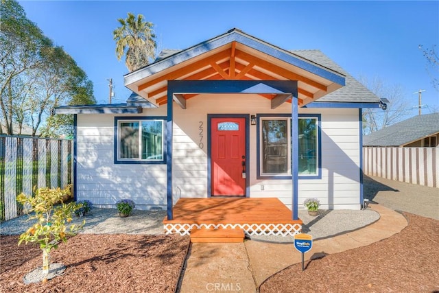 view of front of house featuring fence