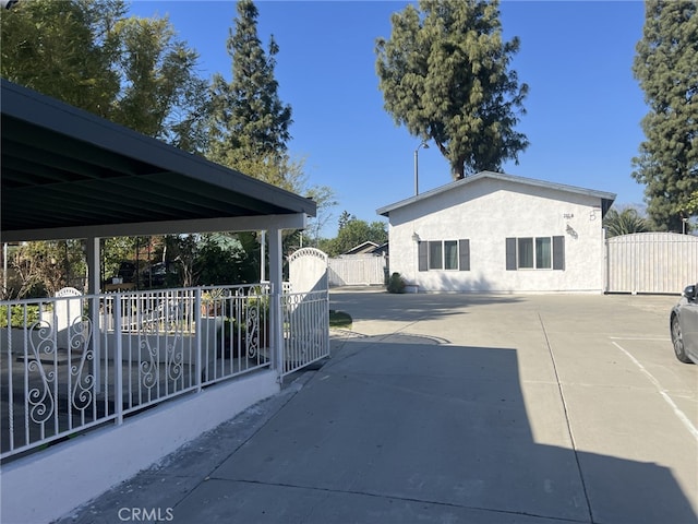 exterior space featuring fence and a gate