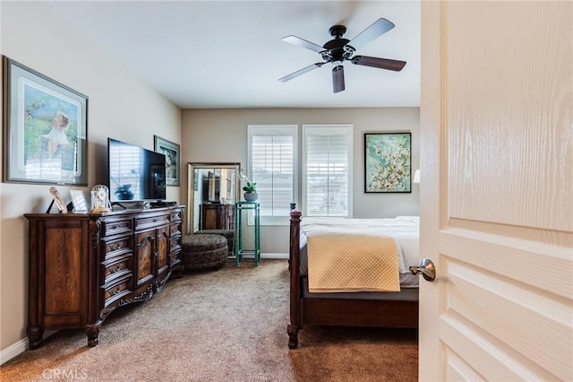 carpeted bedroom featuring ceiling fan and baseboards