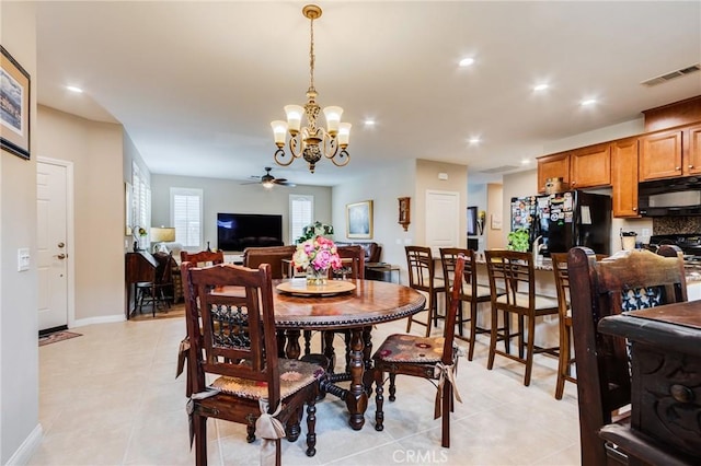 dining area featuring light tile patterned floors, recessed lighting, visible vents, baseboards, and ceiling fan with notable chandelier