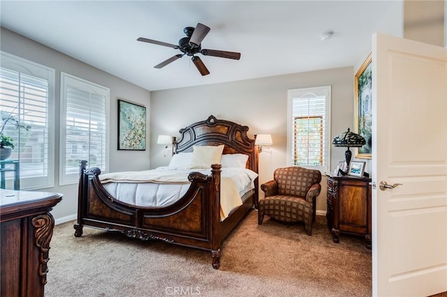 bedroom featuring ceiling fan, carpet floors, and baseboards