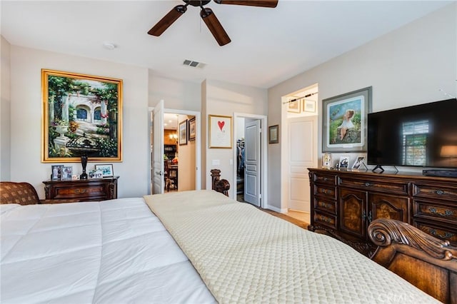 bedroom with visible vents and a ceiling fan