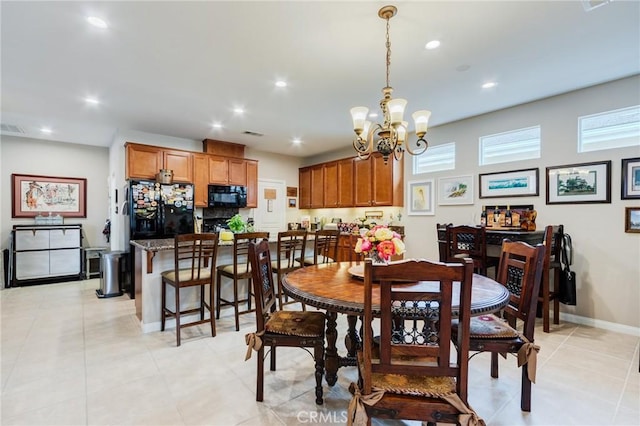 dining room with an inviting chandelier, visible vents, baseboards, and recessed lighting