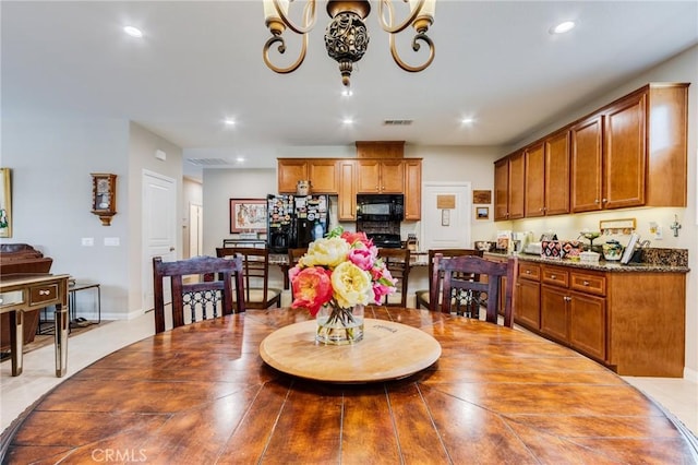 dining space featuring recessed lighting, visible vents, and an inviting chandelier