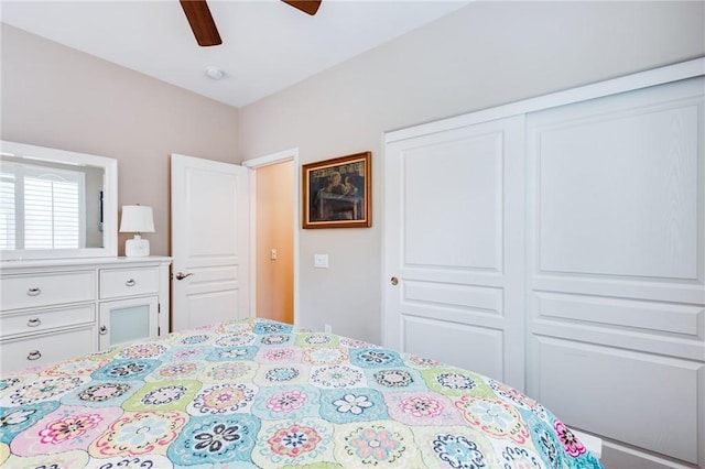 bedroom with ceiling fan and a closet