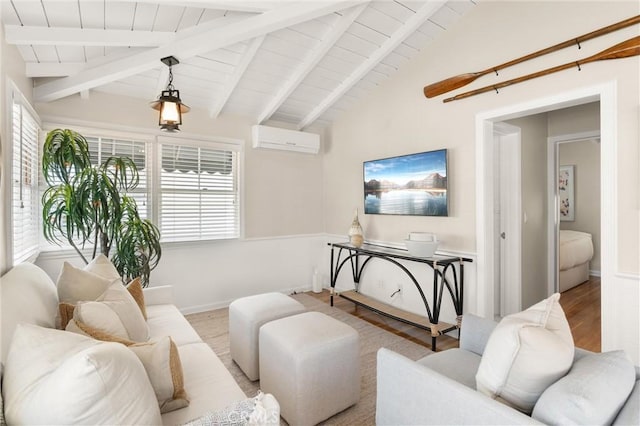 living room with light wood-type flooring, a wall mounted air conditioner, vaulted ceiling with beams, and baseboards