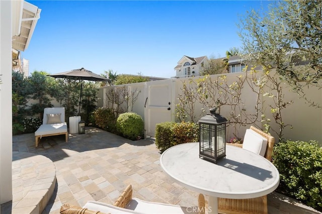 view of patio / terrace featuring fence