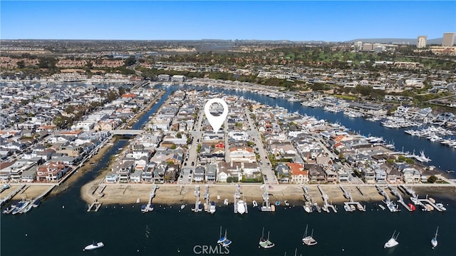 birds eye view of property featuring a water view and a residential view