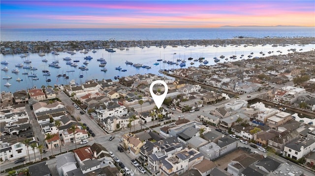 bird's eye view featuring a water view and a residential view