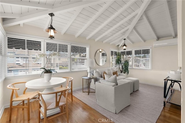 sunroom / solarium with lofted ceiling with beams