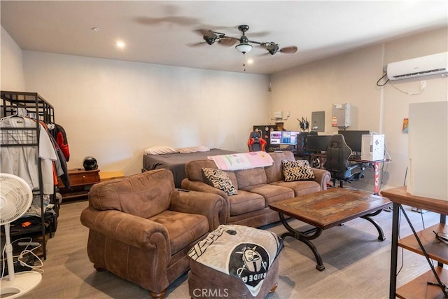 living area with ceiling fan, light wood-type flooring, a wall mounted air conditioner, and electric panel