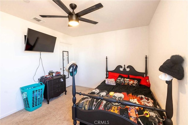 bedroom featuring light carpet, baseboards, visible vents, and a ceiling fan