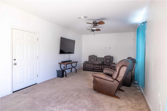 living area with a ceiling fan, light carpet, visible vents, and baseboards