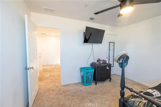 bedroom featuring light colored carpet, visible vents, ceiling fan, and baseboards