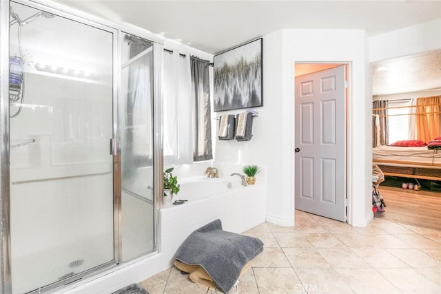 full bath featuring a garden tub, ensuite bathroom, a shower stall, and tile patterned floors