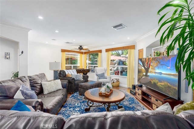 living room featuring recessed lighting, wood finished floors, visible vents, and crown molding