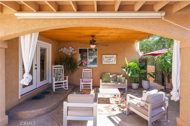 view of patio / terrace with a ceiling fan and french doors