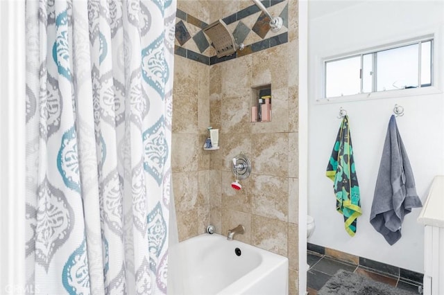 bathroom featuring toilet, shower / bathtub combination with curtain, baseboards, and tile patterned floors