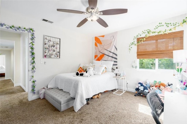 bedroom with carpet, visible vents, ceiling fan, and baseboards