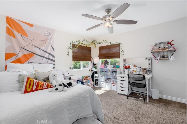 bedroom with ceiling fan, carpet, and baseboards