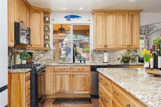 kitchen with decorative backsplash, light stone counters, stainless steel appliances, open shelves, and a sink