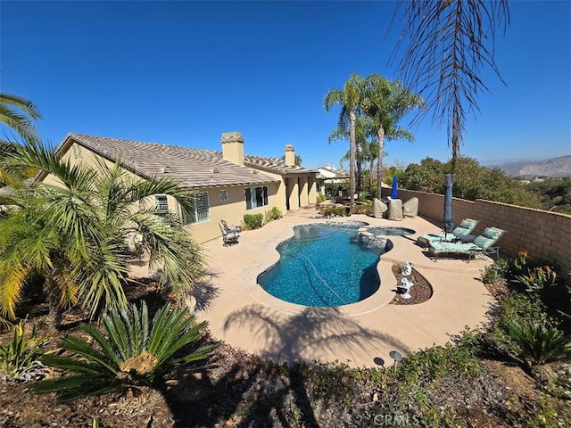 view of swimming pool with a fenced in pool, a patio, and fence