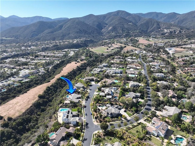 drone / aerial view with a residential view and a mountain view