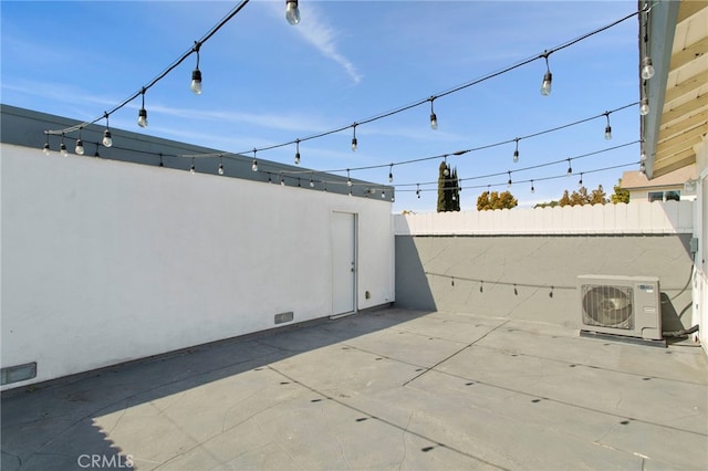 view of patio featuring ac unit, visible vents, and fence