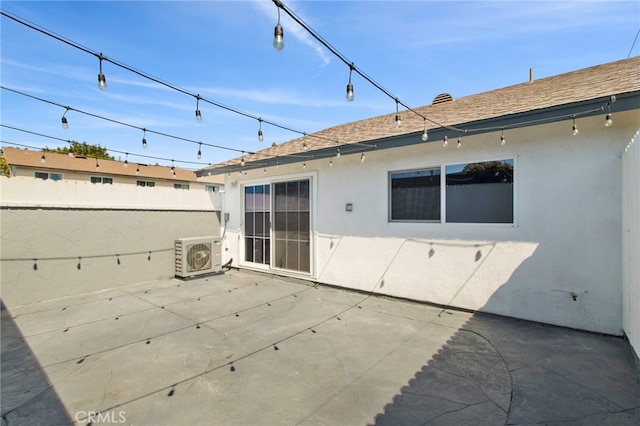 rear view of property with ac unit, roof with shingles, a patio, stucco siding, and fence