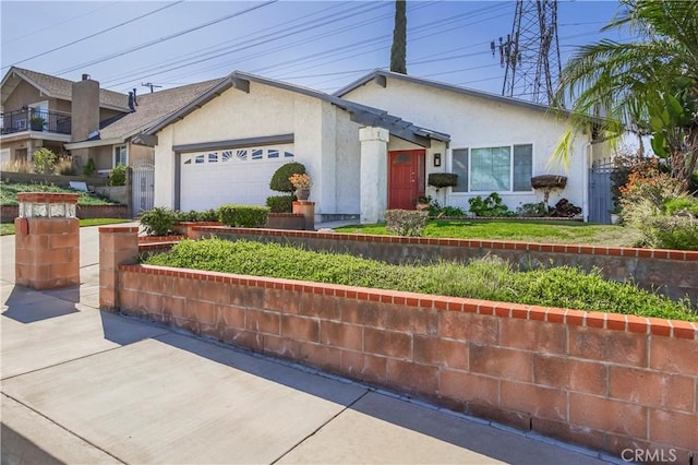 view of front of house with an attached garage and stucco siding