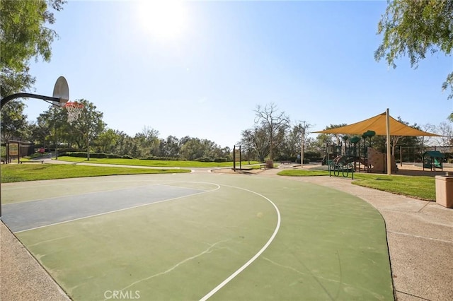 view of sport court featuring playground community, a yard, and community basketball court