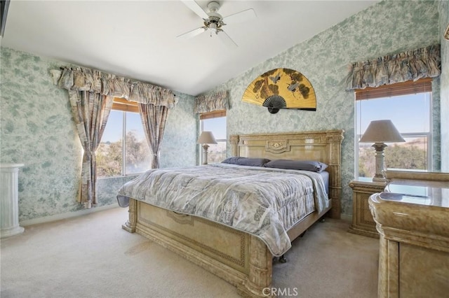 bedroom with baseboards, multiple windows, carpet flooring, and wallpapered walls