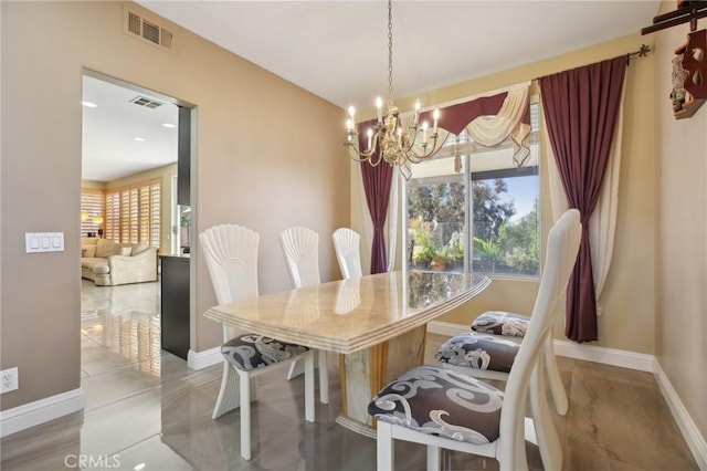 dining space featuring visible vents, a chandelier, and a wealth of natural light