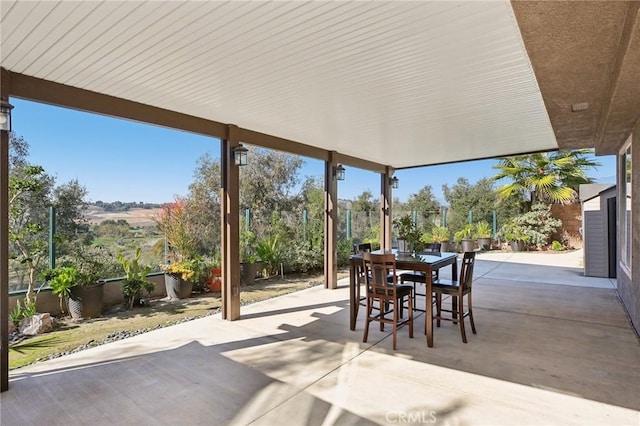 view of patio with outdoor dining area and a fenced backyard