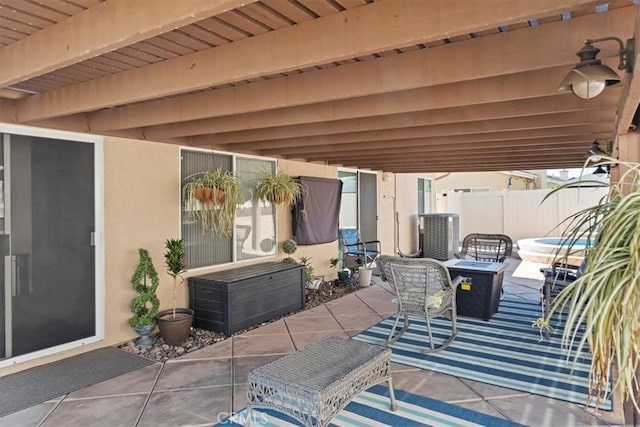 view of patio / terrace with fence and central AC