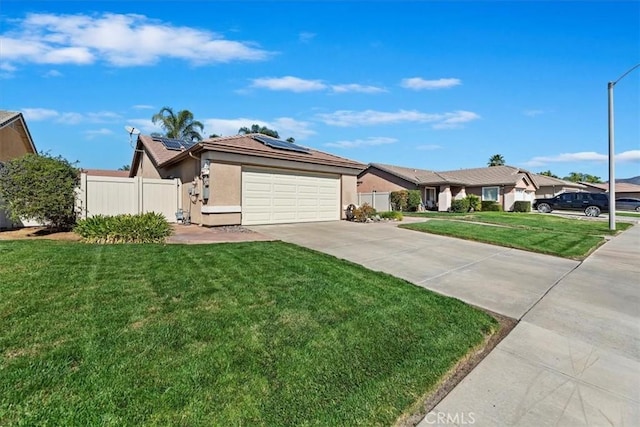 ranch-style house with stucco siding, solar panels, concrete driveway, a front yard, and fence