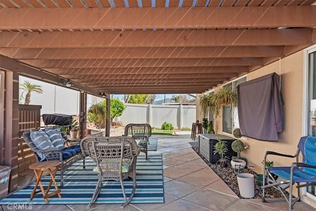 view of patio featuring fence