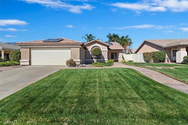 ranch-style house with a front lawn, solar panels, and stucco siding