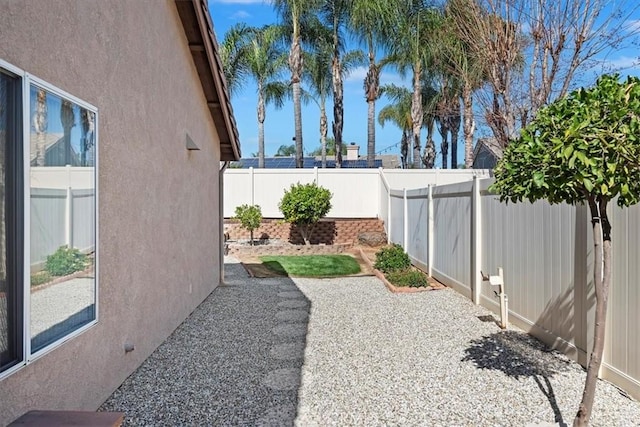 view of yard with a patio area and a fenced backyard