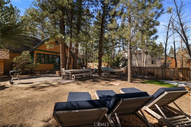 exterior space with a patio area and fence