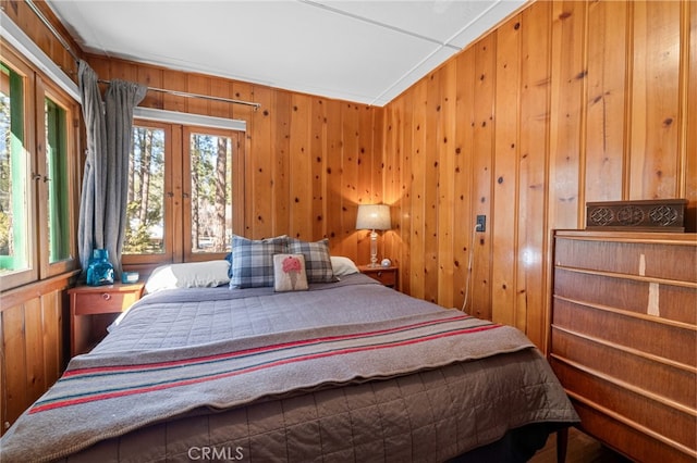 bedroom with wooden walls